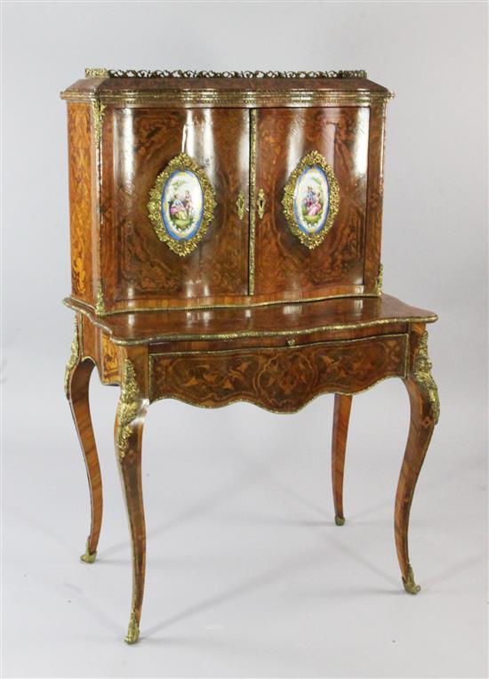 A Louis XV style marquetry inlaid serpentine shaped bonheur du jour, W.2ft 8.5in.